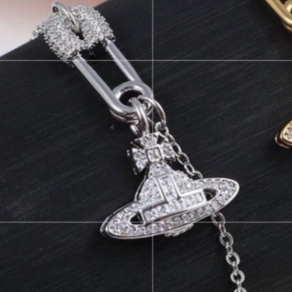Vivienne Westwood Jewelry - Vivienne Westwood silver tone crystal safety pin Orb chain bracelet